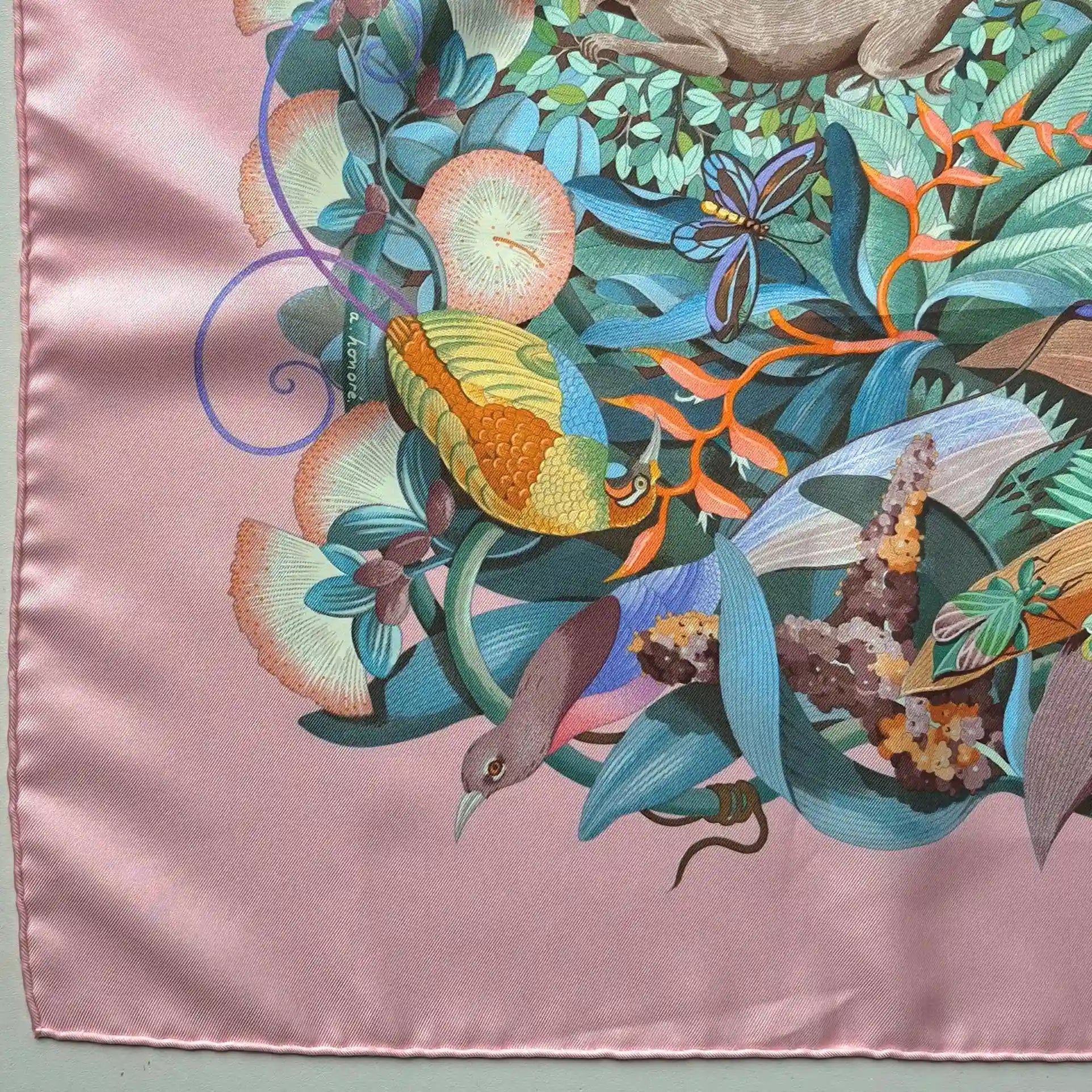 Hermès Au Cœur de la Vie silk scarf by Aline Honoré – pink and celadon colorway – lush botanical pattern with exotic birds, tropical foliage and central medallion detail