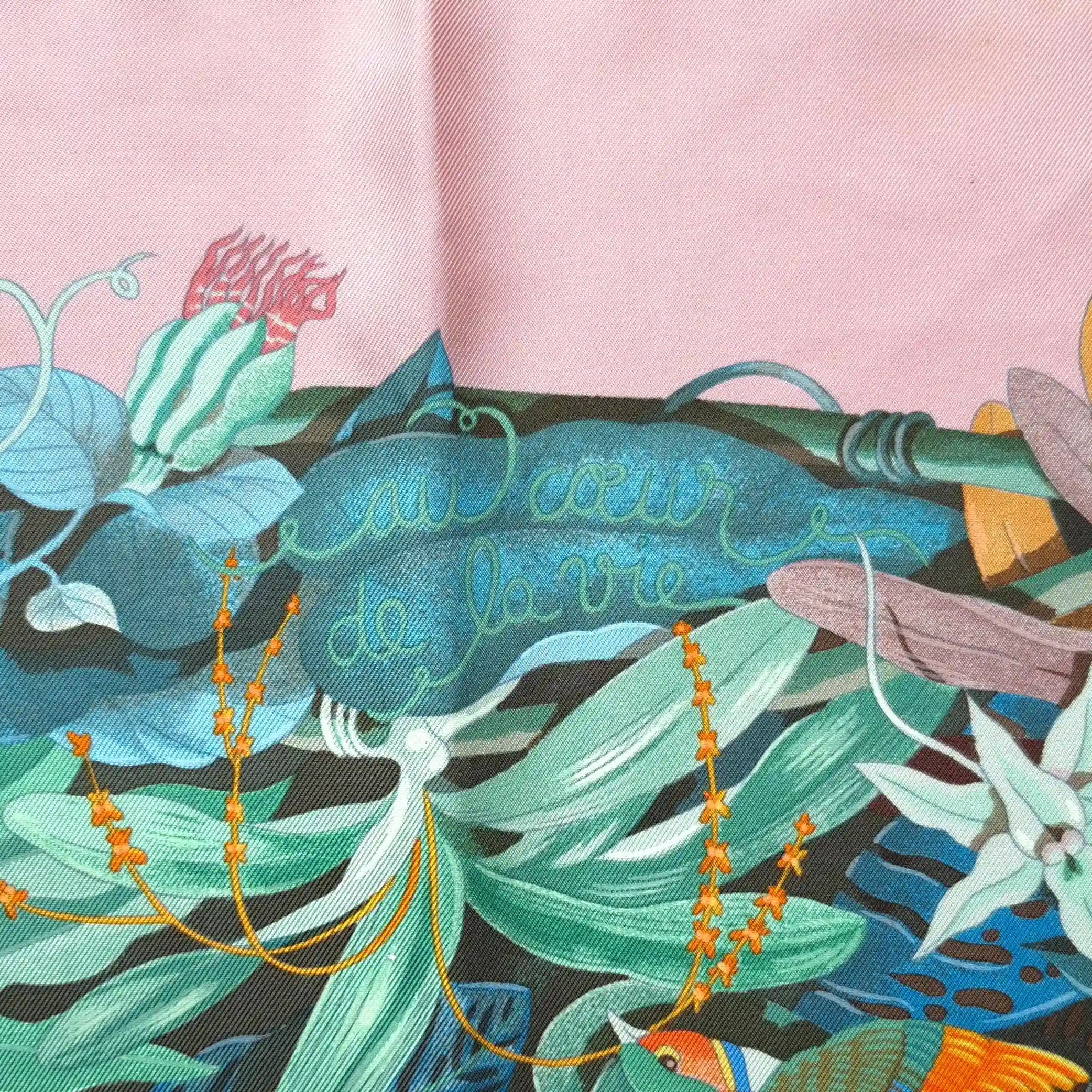 Hermès Au Cœur de la Vie silk scarf by Aline Honoré – pink and celadon colorway – lush botanical pattern with exotic birds, tropical foliage and central medallion