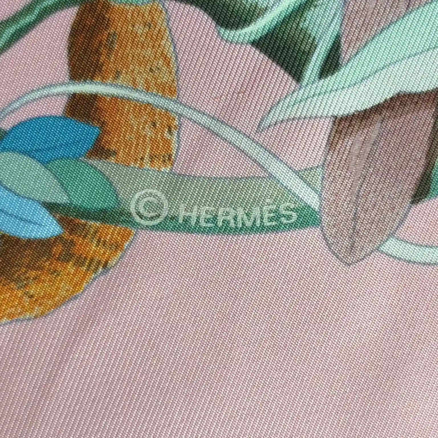 Hermès Au Cœur de la Vie silk scarf by Aline Honoré – pink and celadon colorway – lush botanical pattern with exotic birds, tropical foliage and central medallion detail