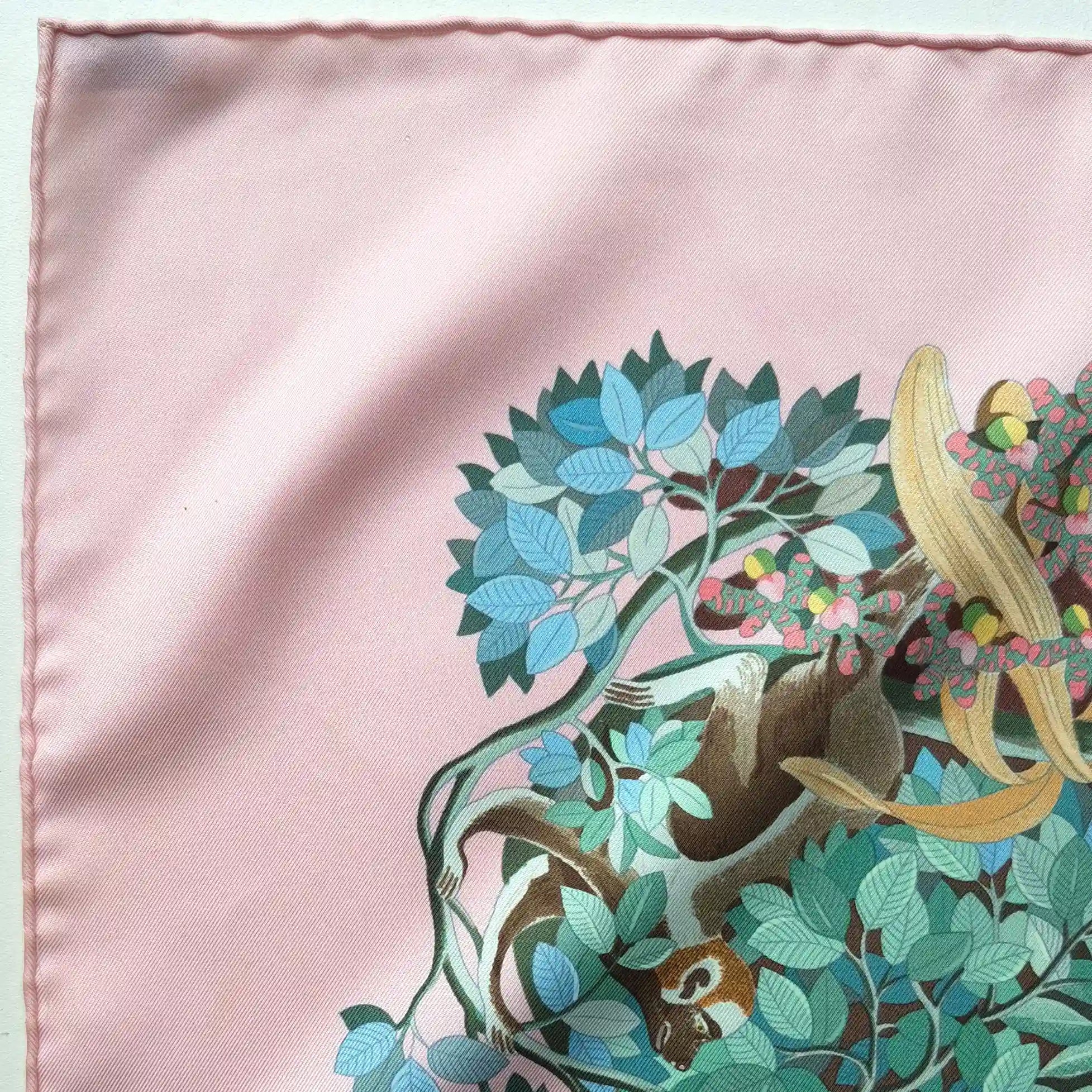 Hermès Au Cœur de la Vie silk scarf by Aline Honoré – pink and celadon colorway – lush botanical pattern with exotic birds, tropical foliage and central medallion detail