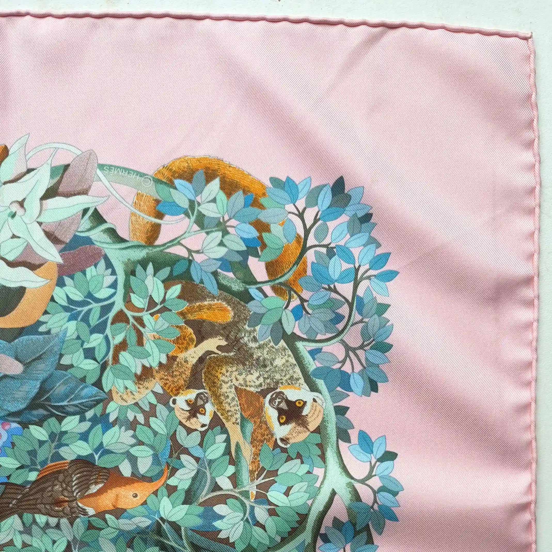 Hermès Au Cœur de la Vie silk scarf by Aline Honoré – pink and celadon colorway – lush botanical pattern with exotic birds, tropical foliage and central medallion detail