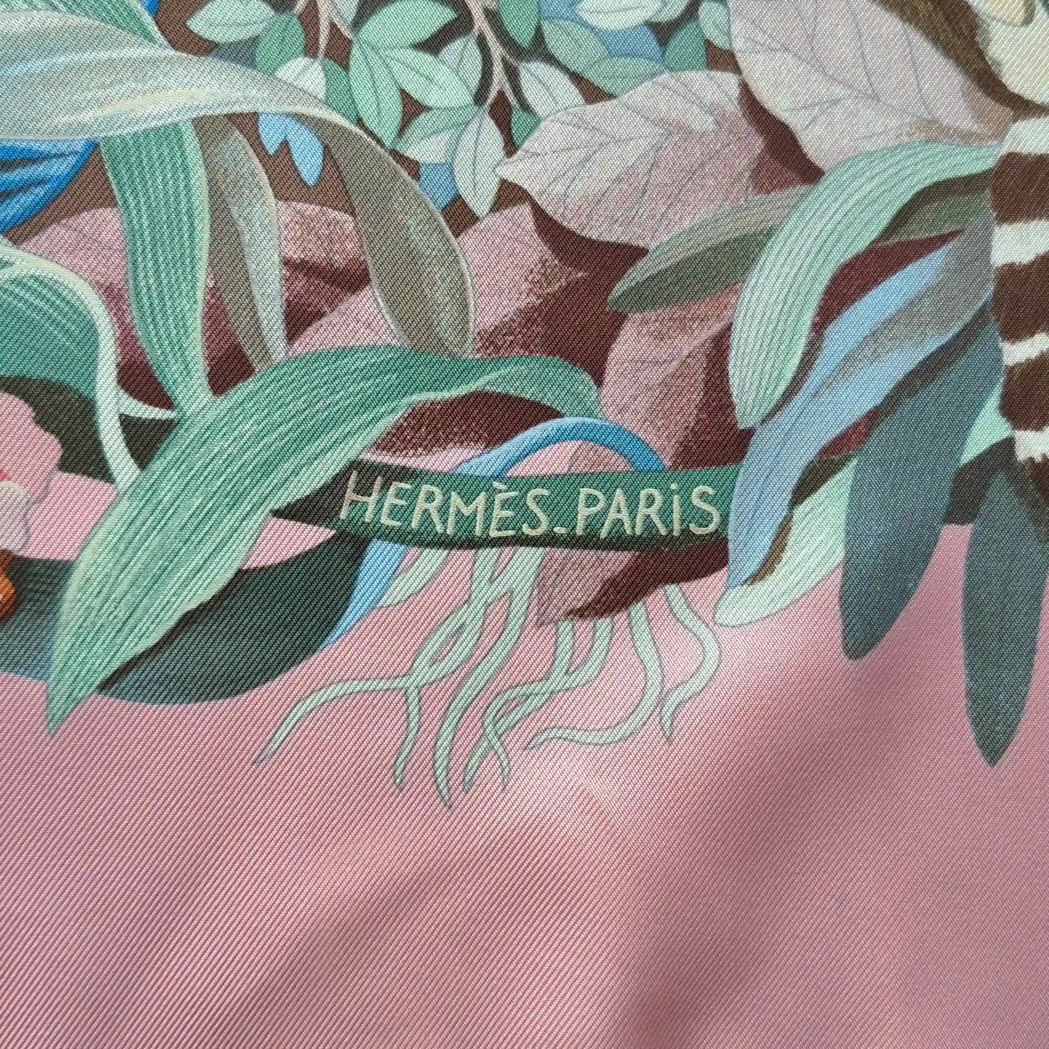 Hermès Au Cœur de la Vie silk scarf by Aline Honoré – pink and celadon colorway – lush botanical pattern with exotic birds, tropical foliage and central medallion detail