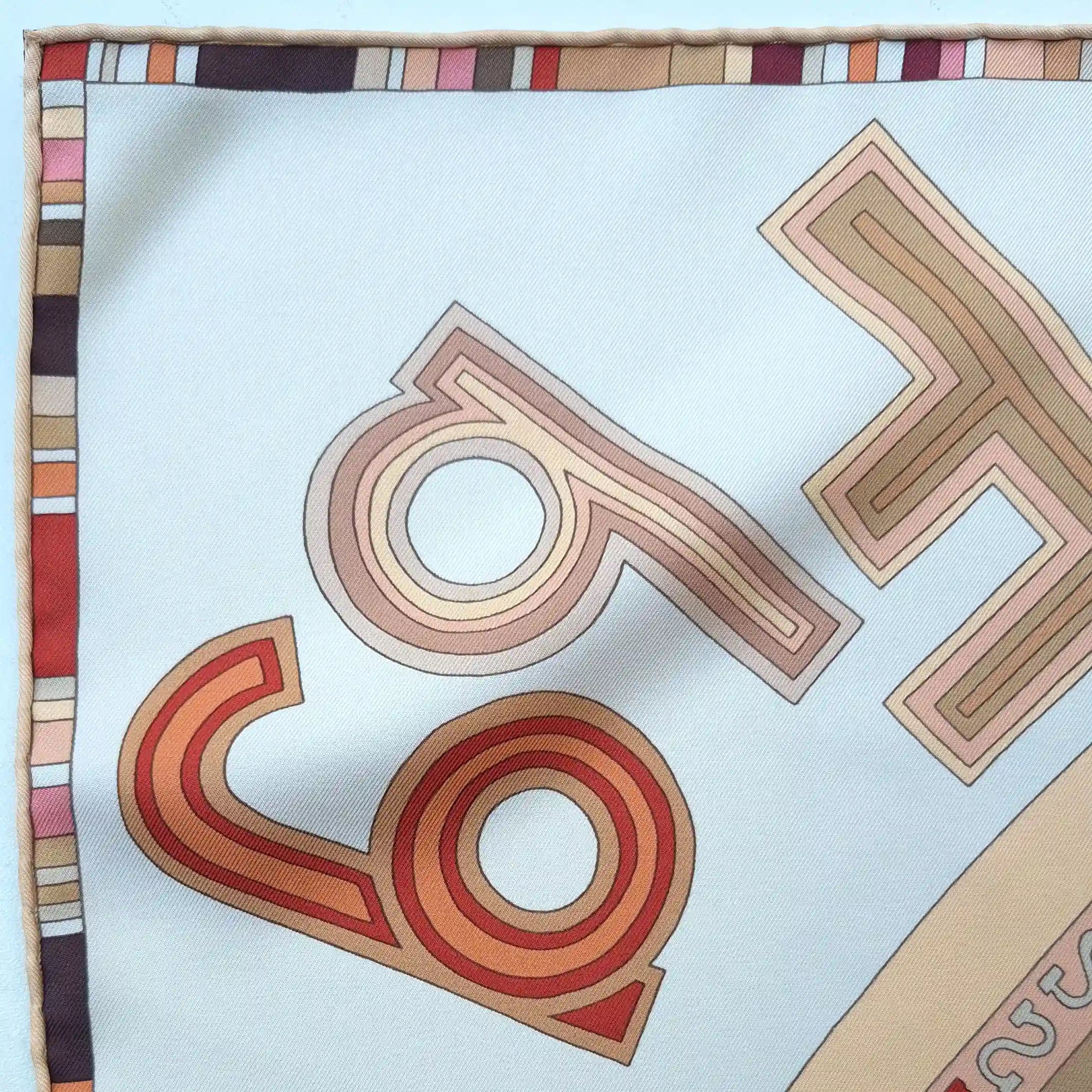 hermes tohu bohu claudia stuhlhofer mayr silk scarf beige red concentric typography detail